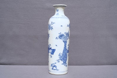 A large Chinese blue and white rouleau vase with flower vases, Transitional period